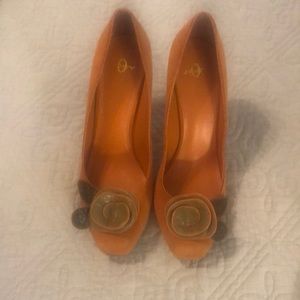 Joey autumn orange with olive leather “roses.”